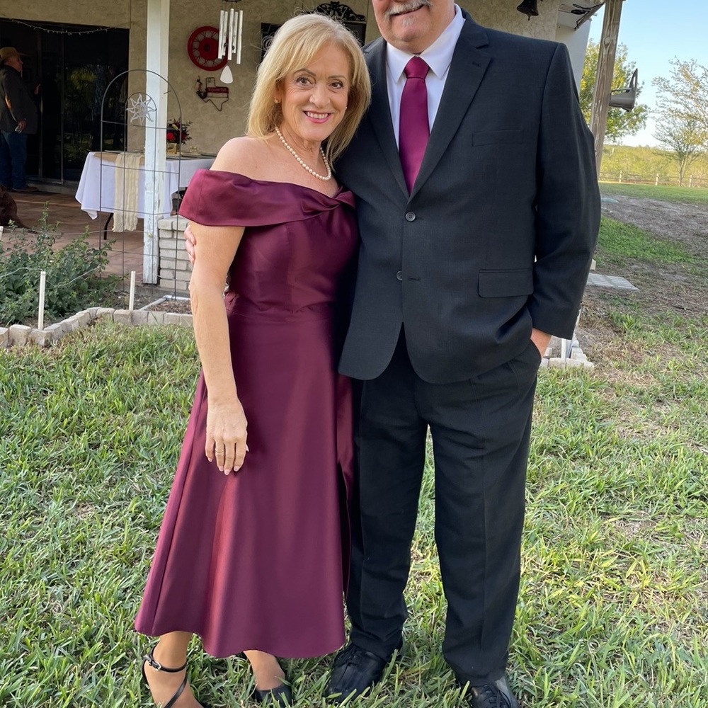 Deep burgundy, off shoulder, tea length Mother of the Bride dress.